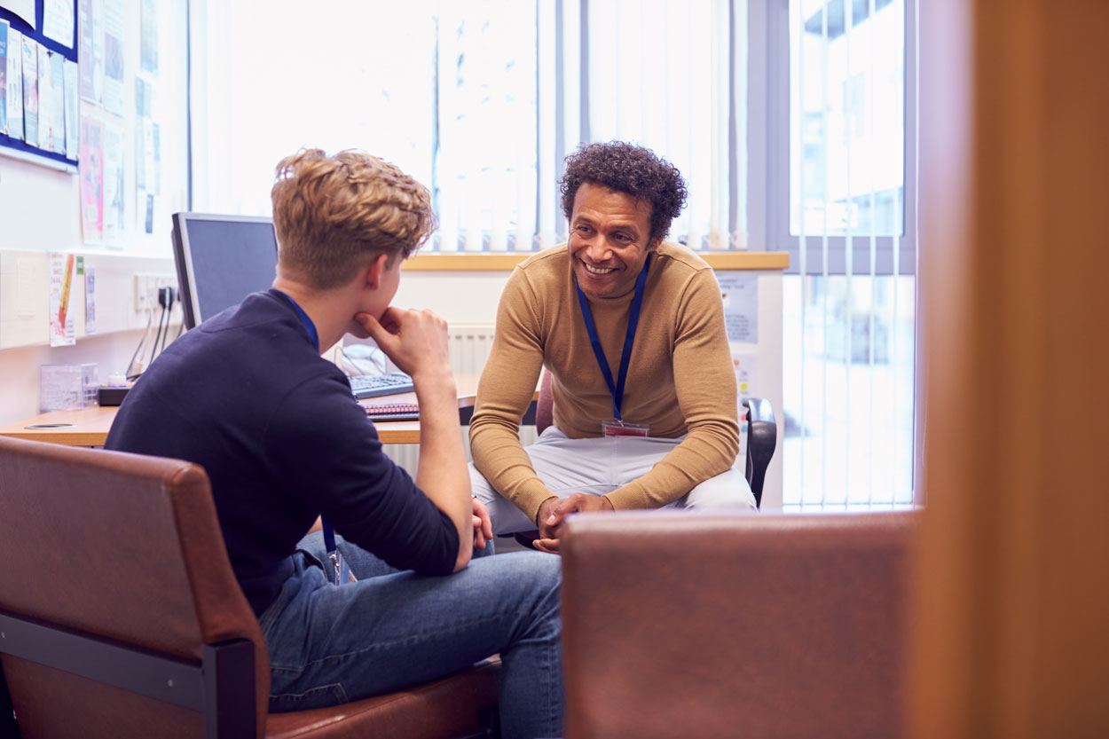 male tutor counselling male student