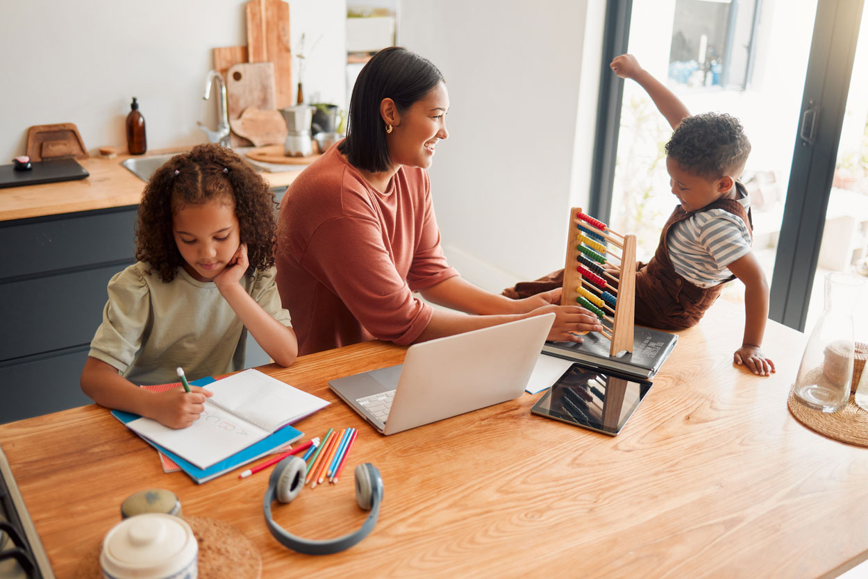 mother homeschooling 2 children